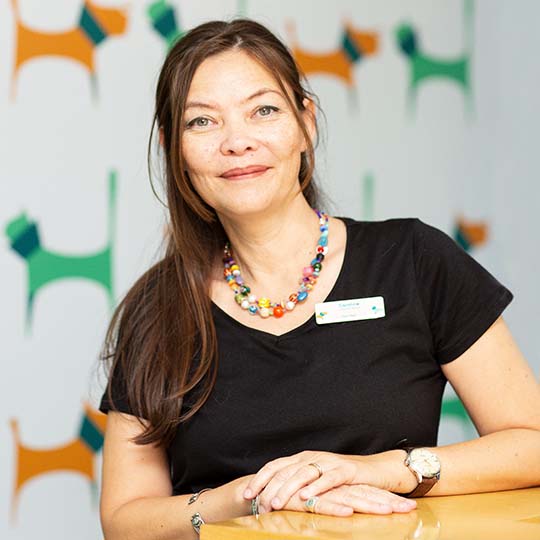 caring vet team comforting a dog at 2Feet4Paws pet clinic Dubai